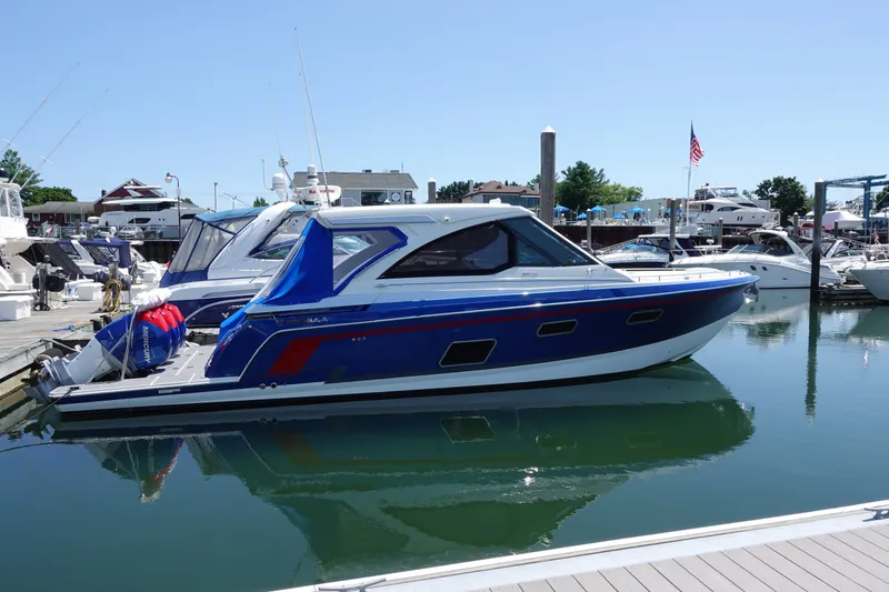 Slide: The Image of 2022 Formula 380 Super Sport Crossover OB docked in a marina. - 1