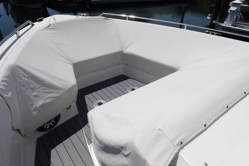 Slide: The Image of 2022 Formula 380 Super Sport Crossover OB boat with covered seating area. - 16