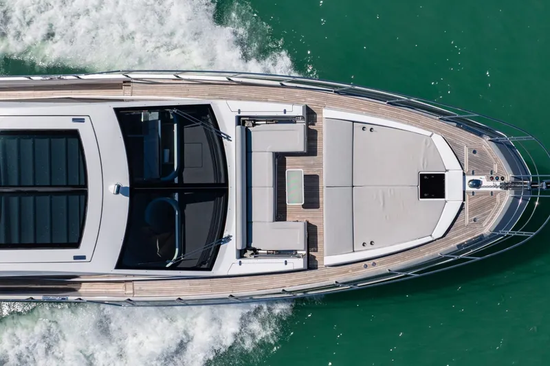 Slide: The Image of Overhead view of 2018 Azimut S7 yacht cruising on turquoise water. - 13