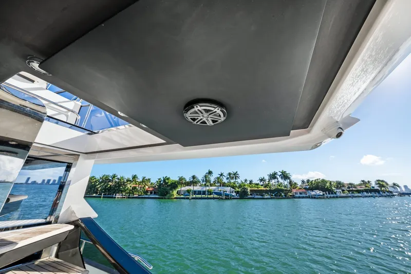 Slide: The Image of 2018 Azimut S7 yacht view with waterfront scenery and palm trees. - 25