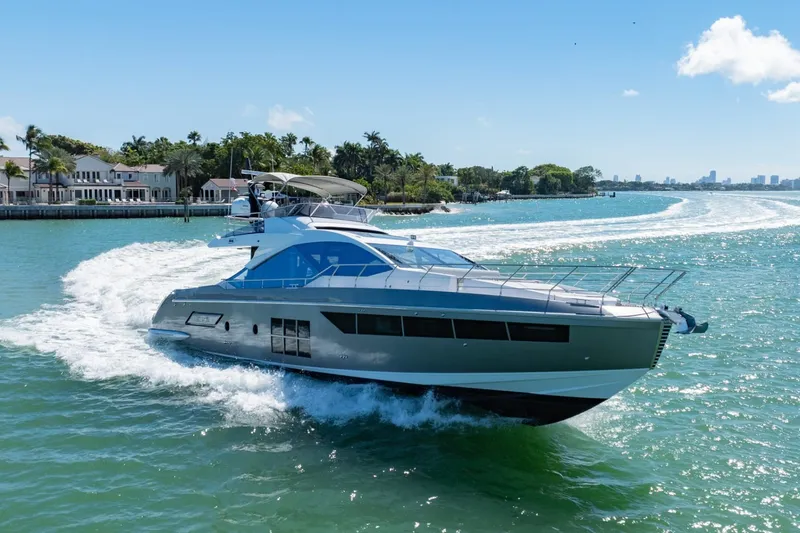Slide: The Image of 2018 Azimut S7 yacht cruising on a sunny day in a coastal area. - 28