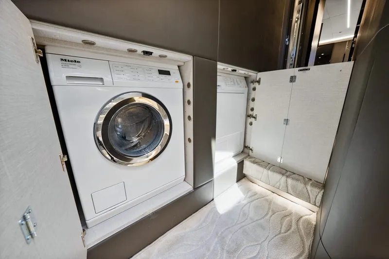 Slide: The Image of Laundry area with Miele washing machine inside 2018 Azimut S7 yacht. - 31