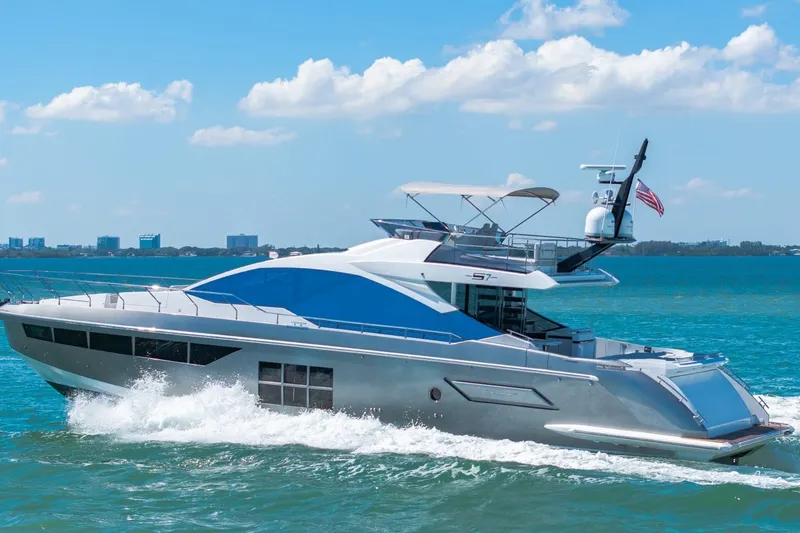 Slide: The Image of Luxurious 2018 Azimut S7 yacht cruising on clear blue waters under a sunny sky. - 35