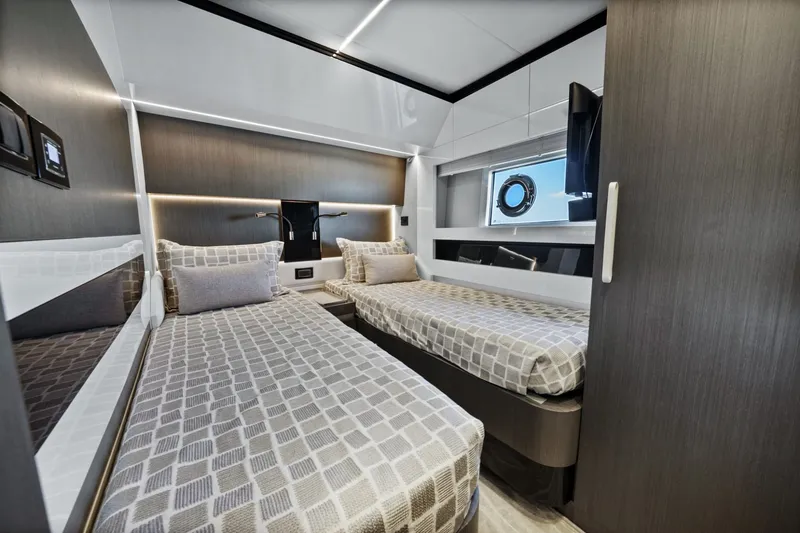 Slide: The Image of Luxurious 2018 Azimut S7 yacht cabin with twin beds and modern decor. - 42
