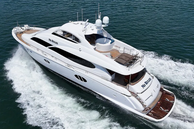 Slide: The Image of Luxury 2006 Lazzara 84 Flybridge yacht cruising on open water. - 5