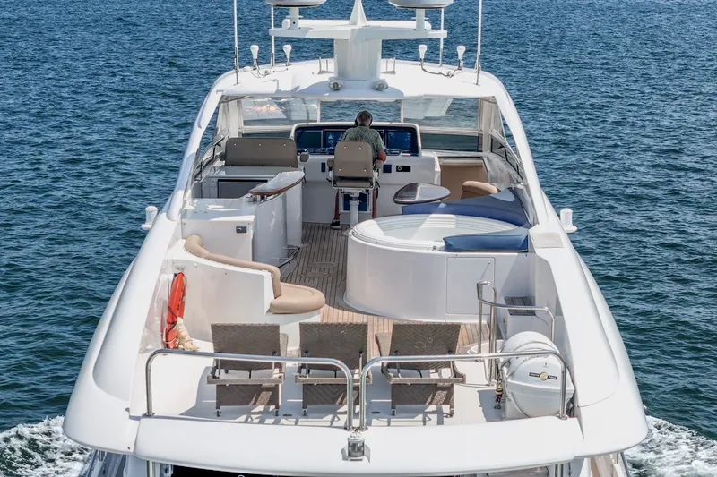 Slide: The Image of Luxury 2006 Lazzara 84 Flybridge yacht cruising on open water. - 40