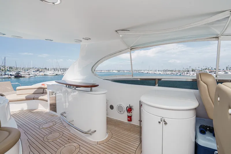 Slide: The Image of Luxurious 2006 Lazzara 84 Flybridge yacht interior with elegant seating and ocean view. - 33