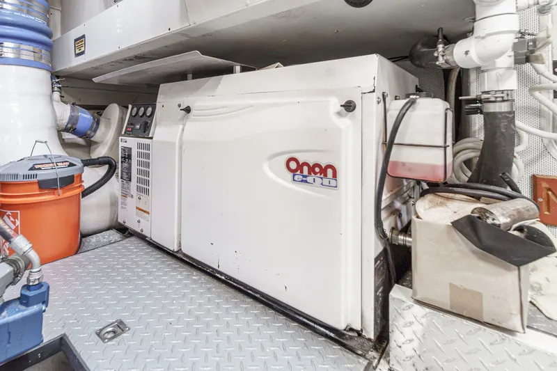Slide: The Image of Engine room of 2006 Lazzara 84 Flybridge yacht featuring Onan generator. - 108