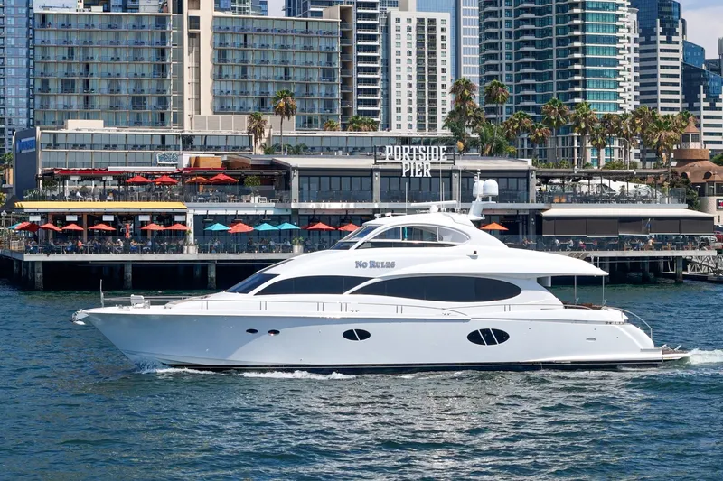 Slide: The Image of Luxury 2006 Lazzara 84 Flybridge yacht cruising near Portside Pier, city skyline backdrop. - 7