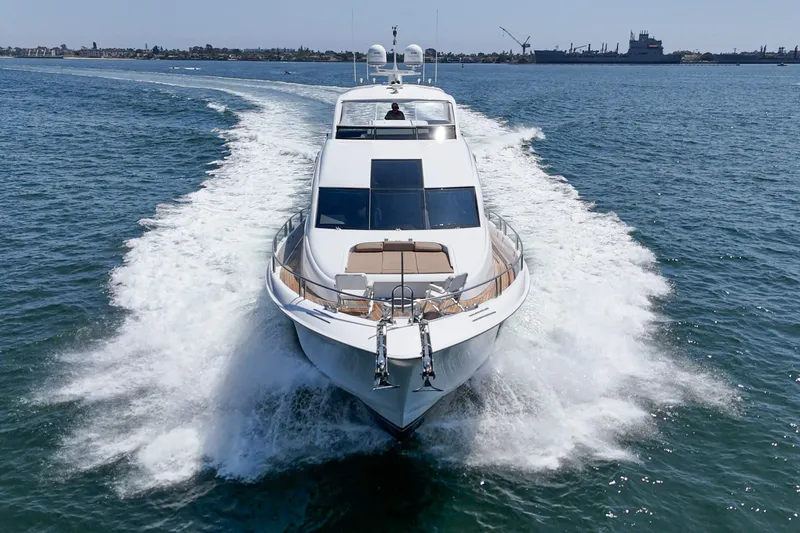 Slide: The Image of Luxury 2006 Lazzara 84 Flybridge yacht cruising on open water. - 17