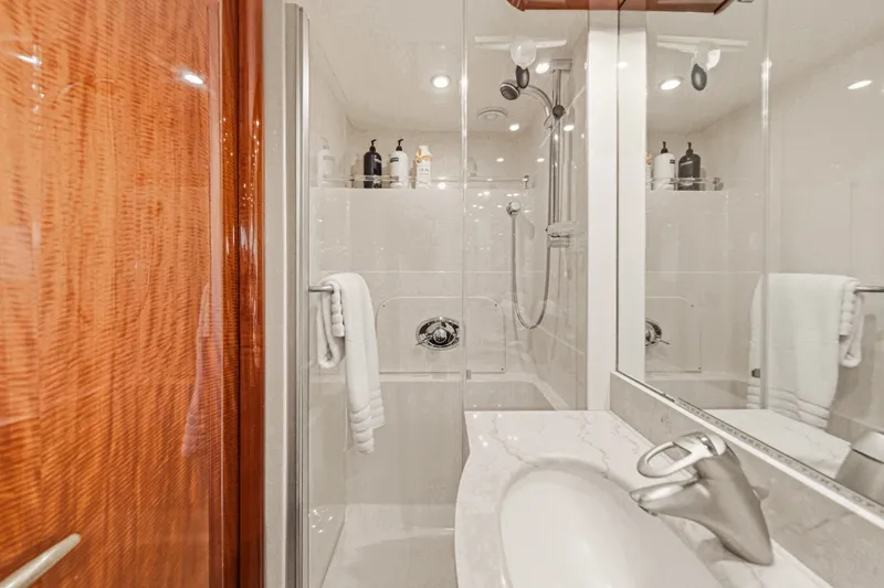 Slide: The Image of Luxurious bathroom in 2006 Lazzara 84 Flybridge yacht with modern fixtures and elegant design. - 76