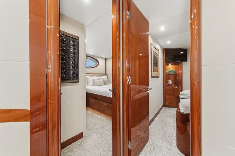 Slide: The Image of Luxurious interior of 2006 Lazzara 84 Flybridge yacht with elegant wood finishes. - 80