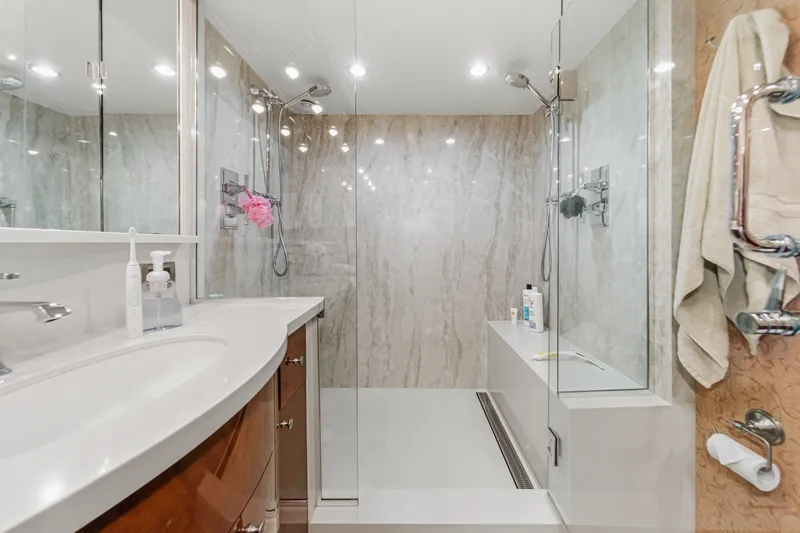 Slide: The Image of Luxurious bathroom in 2006 Lazzara 84 Flybridge yacht with modern shower and elegant fixtures. - 92