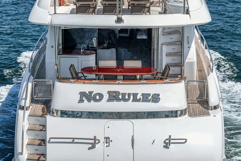 Slide: The Image of Luxury 2006 Lazzara 84 Flybridge yacht "No Rules" cruising on open water. - 20