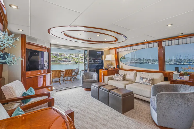 Slide: The Image of Luxurious interior of 2006 Lazzara 84 Flybridge yacht with elegant seating and marina view. - 43