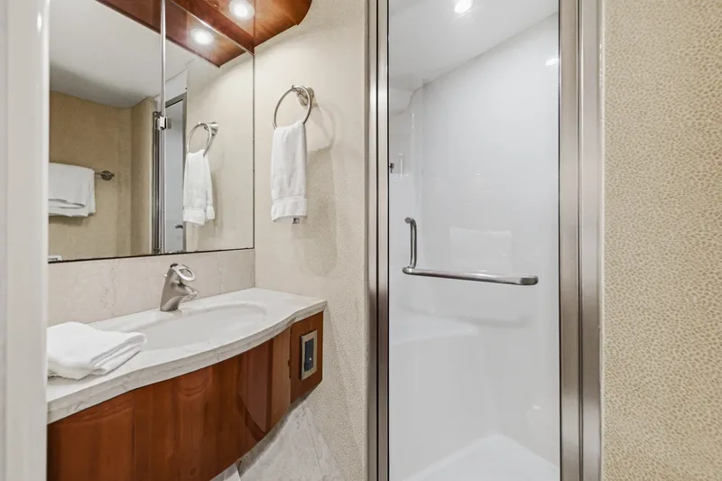 Slide: The Image of Luxurious bathroom on 2006 Lazzara 84 Flybridge yacht with modern fixtures and elegant design. - 72