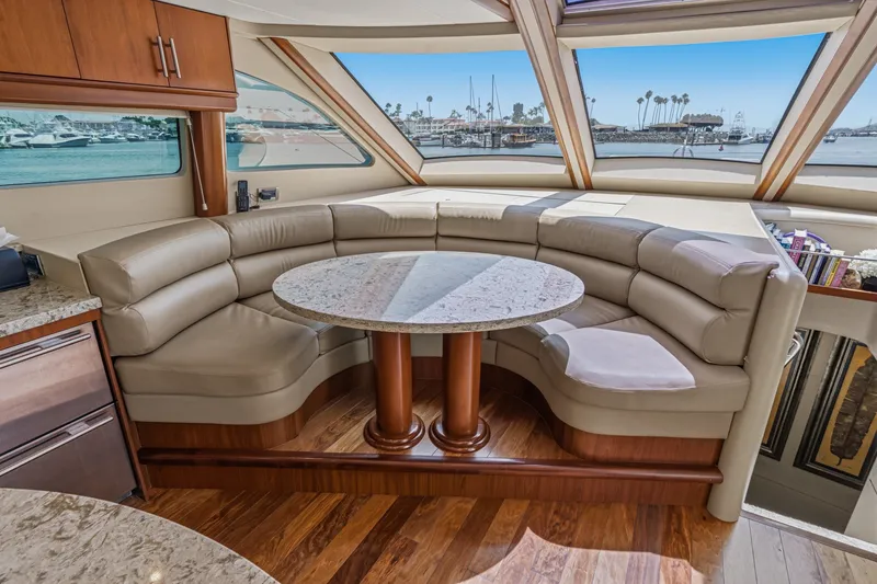 Slide: The Image of Luxurious 2006 Lazzara 84 Flybridge yacht interior with elegant seating and panoramic windows. - 53