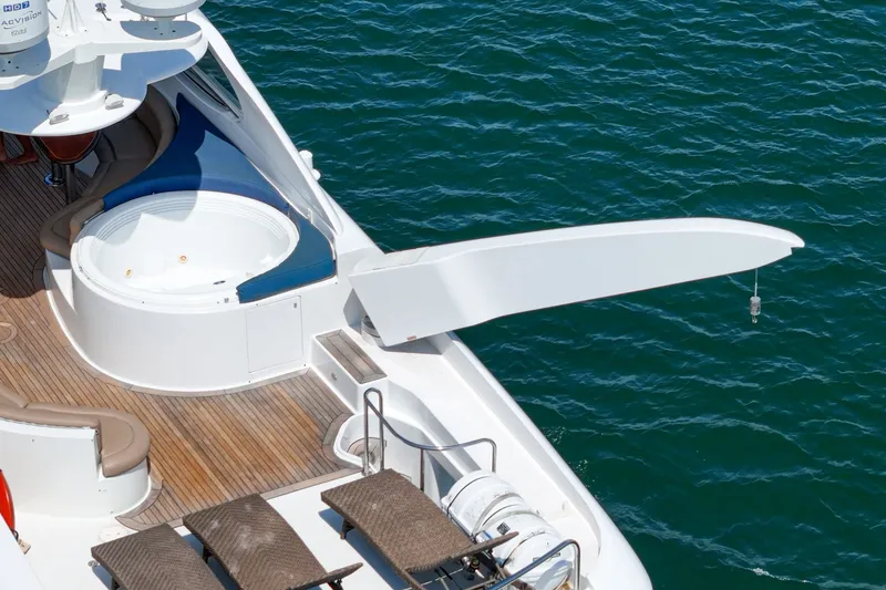 Slide: The Image of Luxury 2006 Lazzara 84 Flybridge yacht with jacuzzi and sun loungers on deck. - 37