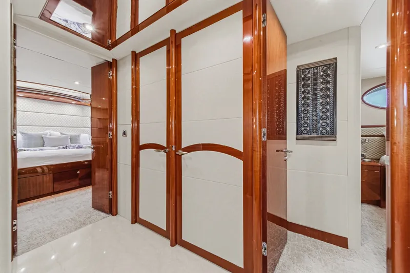 Slide: The Image of Luxurious interior of 2006 Lazzara 84 Flybridge yacht with elegant wood finishes. - 79