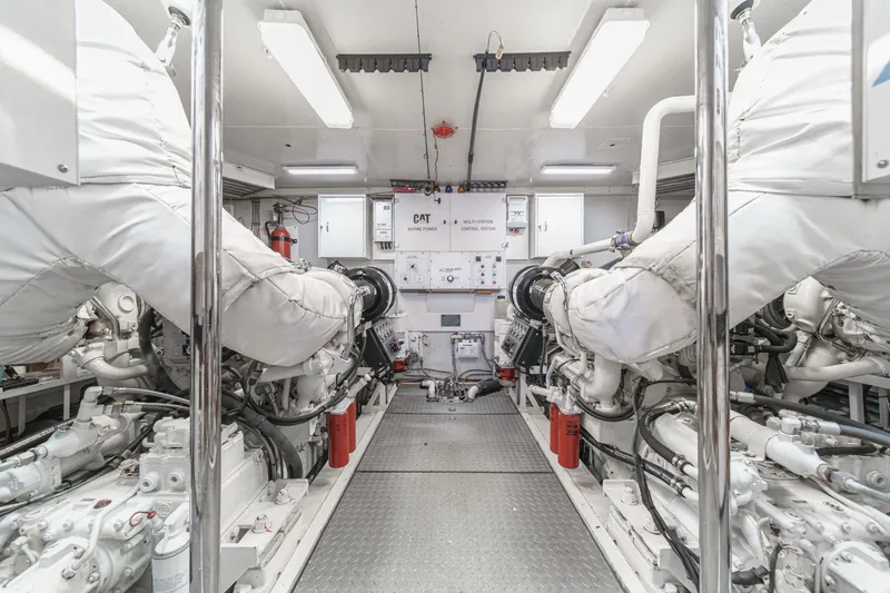 Slide: The Image of Engine room of 2006 Lazzara 84 Flybridge yacht, featuring advanced machinery and systems. - 97