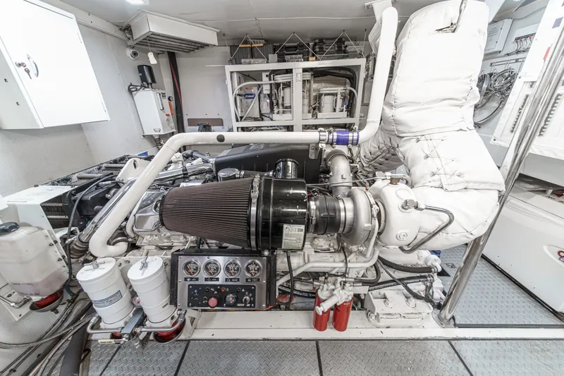 Slide: The Image of Engine room of 2006 Lazzara 84 Flybridge yacht, showcasing detailed machinery and components. - 100