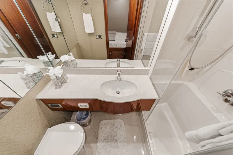 Slide: The Image of Luxurious bathroom in 2006 Lazzara 84 Flybridge yacht with elegant fixtures and marble countertop. - 71