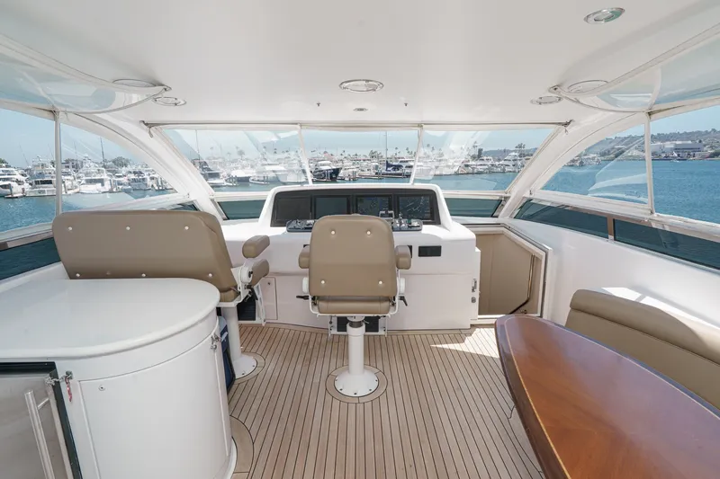 Slide: The Image of Luxurious 2006 Lazzara 84 Flybridge yacht interior with helm and seating area. - 28