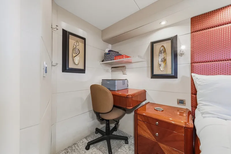Slide: The Image of Small office space on 2006 Lazzara 84 Flybridge yacht with desk, chair, and artwork. - 65