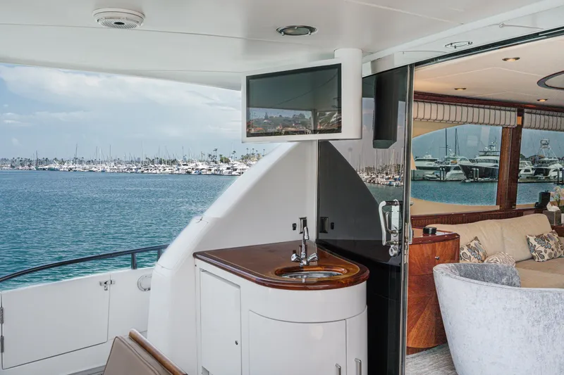Slide: The Image of Luxurious 2006 Lazzara 84 Flybridge yacht interior with ocean view and elegant furnishings. - 22