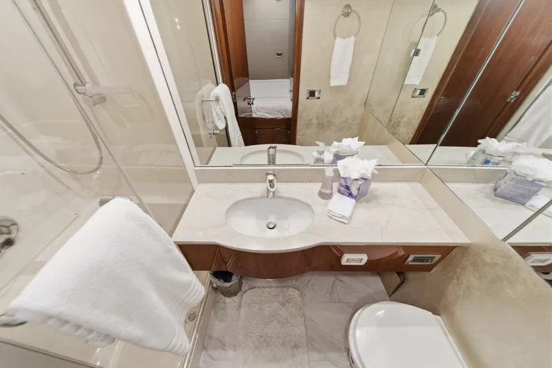 Slide: The Image of Luxurious bathroom in 2006 Lazzara 84 Flybridge yacht with elegant fixtures and marble countertop. - 75