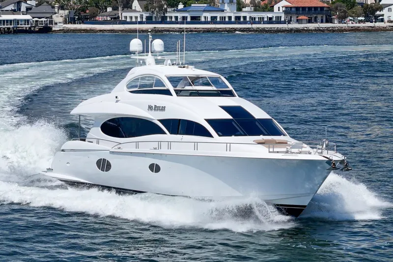 Slide: The Image of Luxury 2006 Lazzara 84 Flybridge yacht cruising on open water. - 9