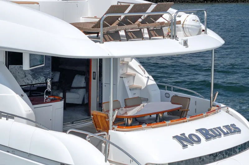 Slide: The Image of Luxury 2006 Lazzara 84 Flybridge yacht with spacious deck and elegant seating area. - 12