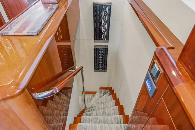 Slide: The Image of Staircase with wooden railings on 2006 Lazzara 84 Flybridge yacht interior. - 77