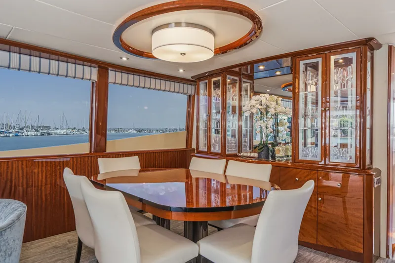 Slide: The Image of Luxurious dining area on 2006 Lazzara 84 Flybridge yacht with elegant wood finishes. - 47