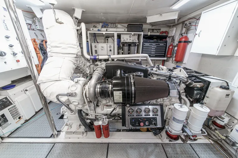 Slide: The Image of Engine room of 2006 Lazzara 84 Flybridge yacht, featuring advanced machinery and equipment. - 105
