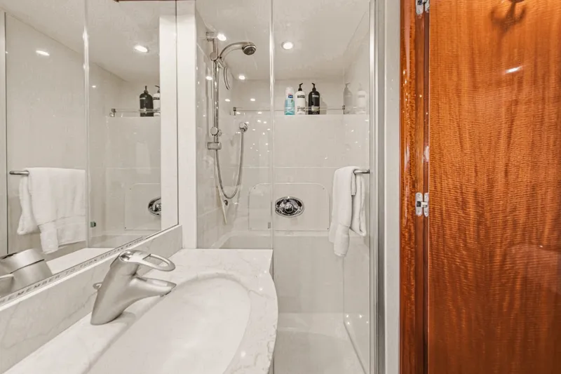 Slide: The Image of Luxurious bathroom on 2006 Lazzara 84 Flybridge yacht with modern fixtures and elegant design. - 70