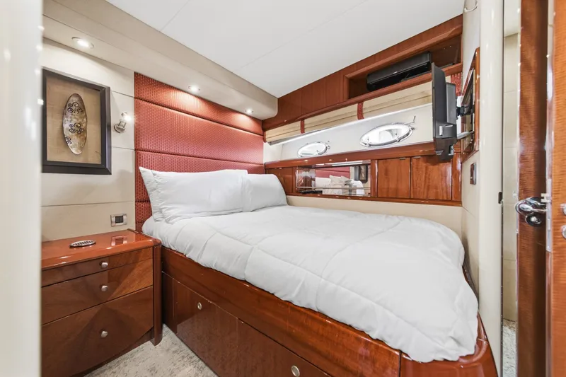 Slide: The Image of Luxurious bedroom interior of 2006 Lazzara 84 Flybridge yacht with elegant wood finishes. - 73