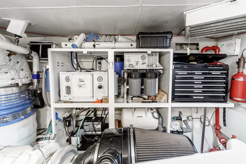 Slide: The Image of Engine room of 2006 Lazzara 84 Flybridge yacht with equipment and storage. - 106