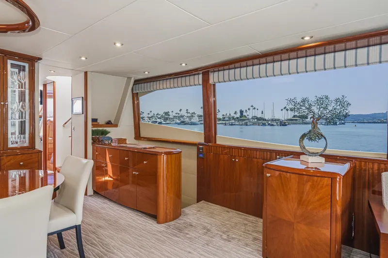 Slide: The Image of Luxurious interior of 2006 Lazzara 84 Flybridge yacht with elegant wood finishes and waterfront view. - 45