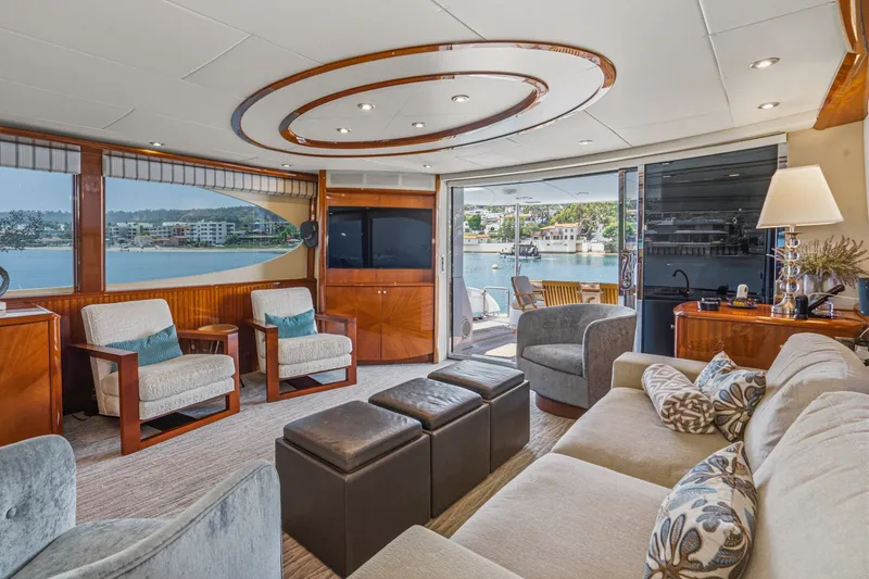 Slide: The Image of Luxurious interior of 2006 Lazzara 84 Flybridge yacht with elegant seating and waterfront view. - 42