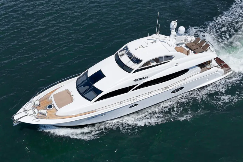 Slide: The Image of Luxury 2006 Lazzara 84 Flybridge yacht cruising on open water. - 1