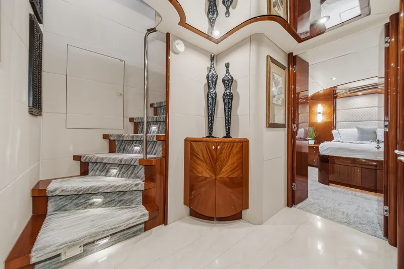 Slide: The Image of Luxurious interior of 2006 Lazzara 84 Flybridge yacht with elegant staircase and bedroom. - 78