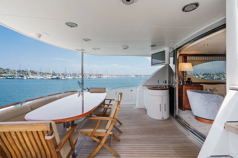 Slide: The Image of Luxurious 2006 Lazzara 84 Flybridge yacht with elegant outdoor seating and ocean view. - 21