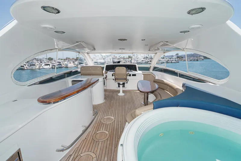Slide: The Image of Luxurious 2006 Lazzara 84 Flybridge yacht with jacuzzi, bar, and ocean view. - 27