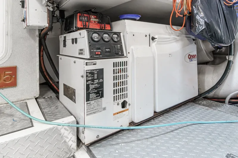 Slide: The Image of Engine room of 2006 Lazzara 84 Flybridge yacht with Onan generator. - 109