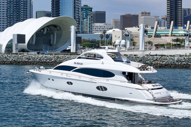 Slide: The Image of Luxury 2006 Lazzara 84 Flybridge yacht cruising near urban waterfront. - 6