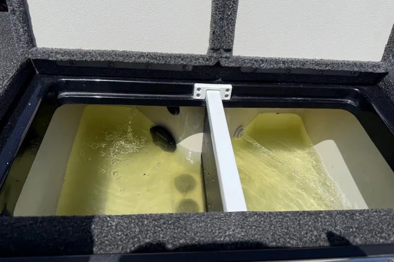 Slide: The Image of Livewell compartment in a 2020 Ranger Z518 boat, filled with water. - 30
