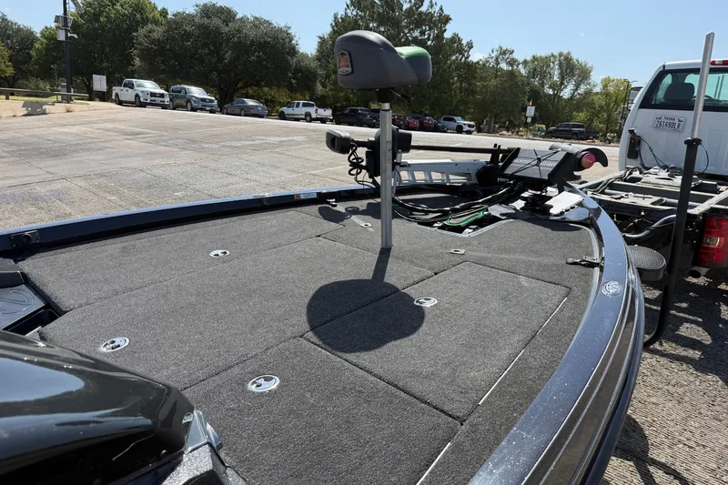 Slide: The Image of 2020 Ranger Z518 boat on trailer, featuring spacious deck and fishing seat. - 21