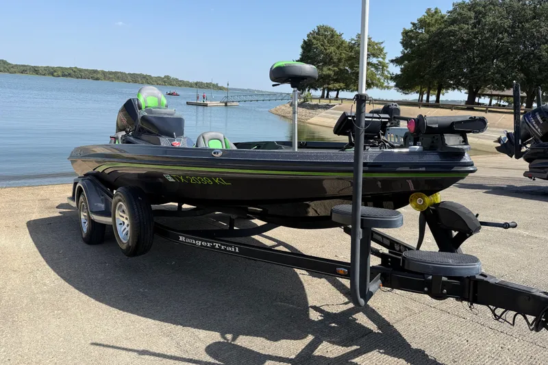 Slide: The Image of 2020 Ranger Z518 boat on trailer by a lake, ready for launch. - 14