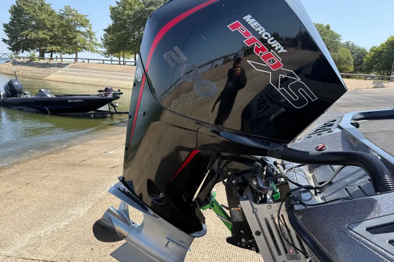 Slide: The Image of 2020 Ranger Z518 boat with Mercury Pro XS engine at a boat ramp. - 23